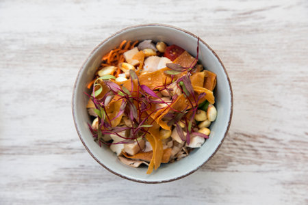 Close-up of bowl with salmon poke, typical Hawaiian salad, top view.の写真素材