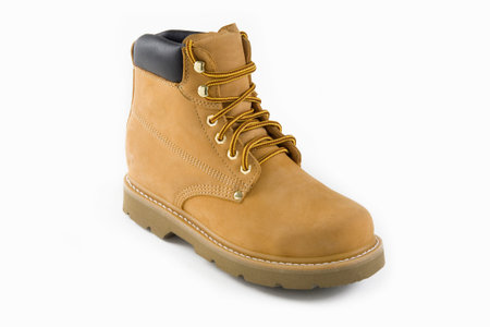 Brown safety boots with steel toe, isolated on white background.