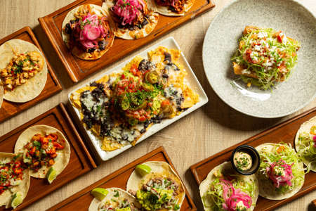 Table with assorted Mexican food as seen from above.の写真素材