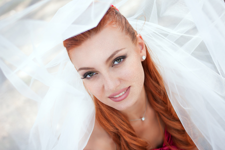 bride in veil close up outsideの写真素材