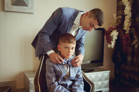 young beautiful caucasian groom man indoor celebrating weddingの写真素材