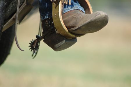 Boot in stirup with blurred backgroundの写真素材