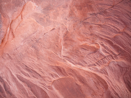 Red rock close up showing texture and pattern backgroundの写真素材