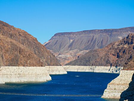 Low water line of Colorado River at Hoover Dam showing the extent of water loss or drought, Arizona and Nevadaの写真素材