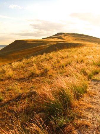 Grassy hills on the prairie at Antelope Island, Utah.の写真素材