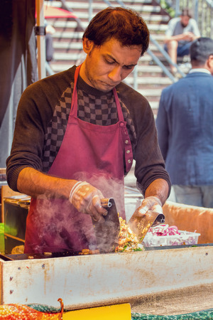 UK, London - May 26, 2016: Street Food Vendor Grilling Asian Style Food.のeditorial素材