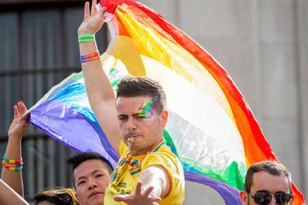 London, UK - June 25, 2016: LGBT Gay Pride Parade, Man With Rainbow Flag.のeditorial素材