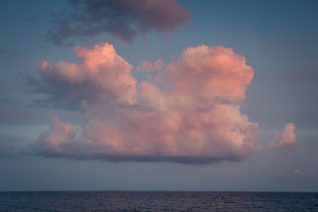 Dramatic cloudscape over the sea at sunset. Nature backgroundの写真素材
