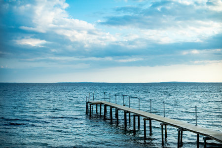 Wooden pier on the Baltic Sea at sunset. Nature background.の写真素材