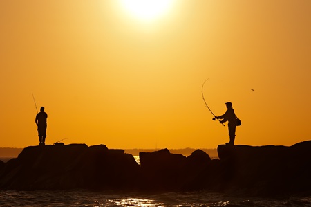 fishermens at sunsetの写真素材