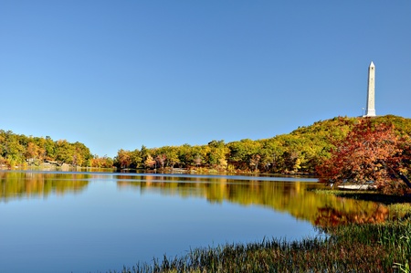 monument on the highest peak and the reflection in the waterの写真素材