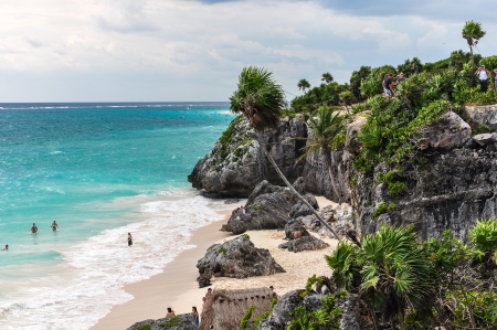 beautiful beach and overgrown cliff - tulum mexicoの写真素材