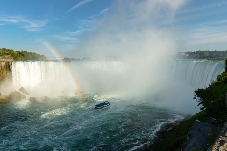 Spectacular rainbow near tourist boat at Niagara Fallsの写真素材