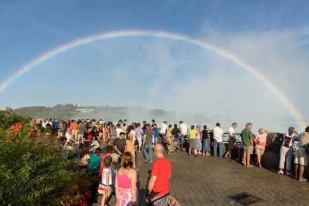 tourists admire Niagara Falls in the bend of the rainbowのeditorial素材