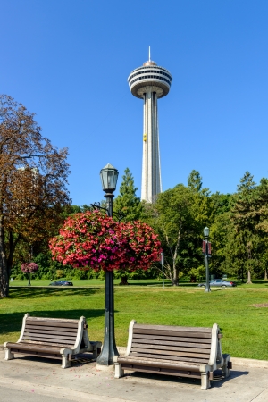Skylon Tower at Niagara Falls Ontario Canada and benches at the frontの写真素材