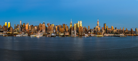 New York City Panorama midtown skyline at dusk over Hudson riverの写真素材