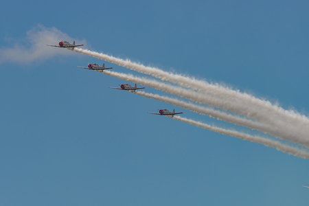 NEW WINDSOR, NY - SEPTEMBER 3, 2016: The GEICO Skytypers Air Show Team perform at the New York Airshow at Stewart Int Airport. SNJ-2 World War II era planes fly in formation.の写真素材