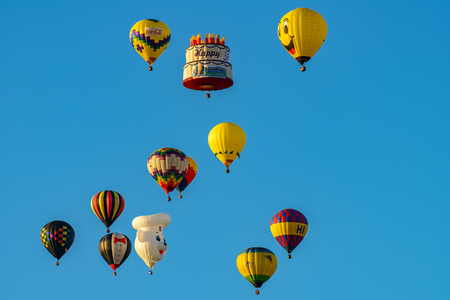 Colorful hot air balloons against blue skyの写真素材