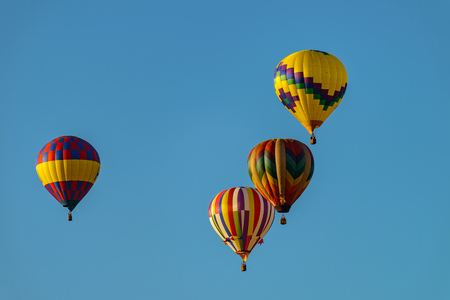 Colorful hot air balloons against blue skyの写真素材