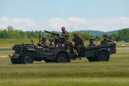 READING, PA - JUNE 3, 2017: World War II reenactment of a battle between American infantryman and German soldiers at Mid-Atlantic Air Museum World War II Weekend and Reenactmentのeditorial素材