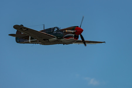 READING, PA - JUNE 3, 2017: Curtiss
P-40M "WARHAWK" in flight during World War II reenactment at Mid-Atlantic Air Museumのeditorial素材