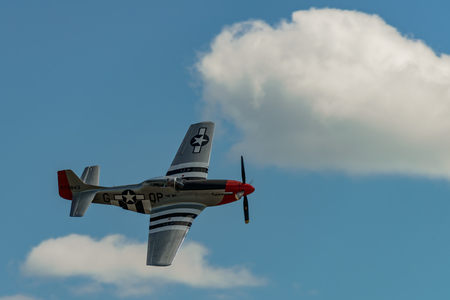 READING, PA - JUNE 3, 2017: NORTH AMERICAN P-51D "MUSTANG"
'RED NOSE' in flight during World War II reenactment at Mid-Atlantic Air Museumのeditorial素材