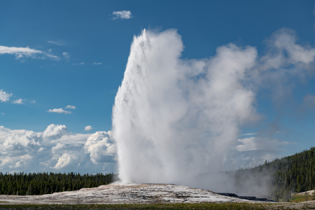 Eruption of Old Faithful geyser at Yellowstone National Park USAの写真素材