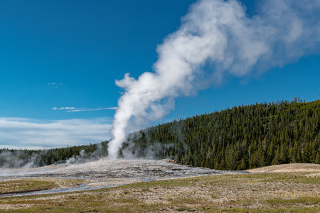 Eruption of Old Faithful geyser at Yellowstone National Park USAの写真素材