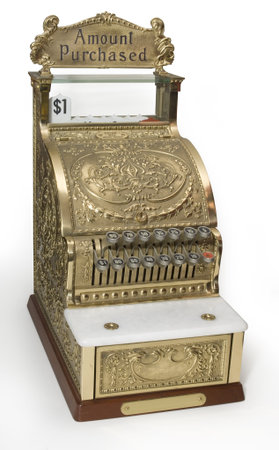 Vintage brass cash register isolated on white with clipping path
