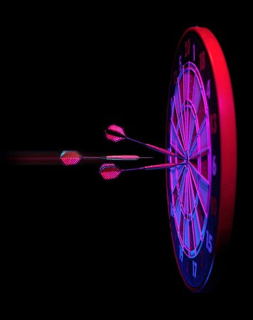 darts hitting dartboard bullseye on blackの写真素材