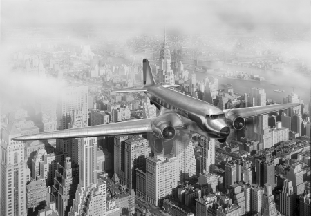Vintage image of a Douglas DC-3 over New York Cityの写真素材