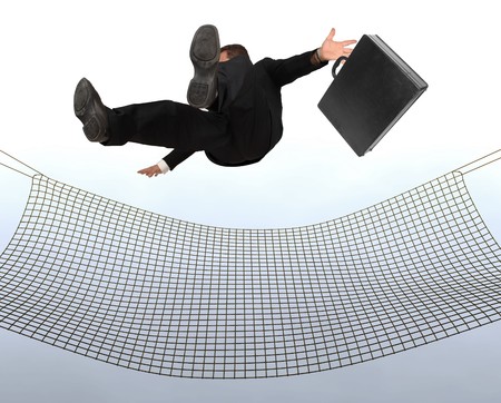 Businessman falling the Sky into a safty netの写真素材