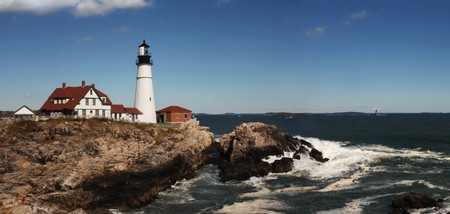 Daytime shot of Portland Head lighthouse panorama with bluffs and Atlantic Oceanの写真素材
