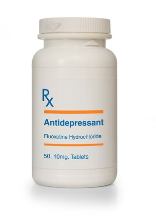Bottle of antidepressant medication, generic equivalent of Prozac on white backgroundの写真素材