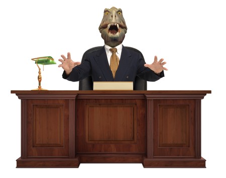 A classic styled corporate desk with with a Tyrannosaurus Rex sitting behind it wearing a suit and tie on white backgroundの写真素材