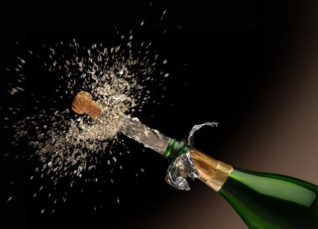 A Quark poping off of the champaign bottle with lots of splash!の写真素材