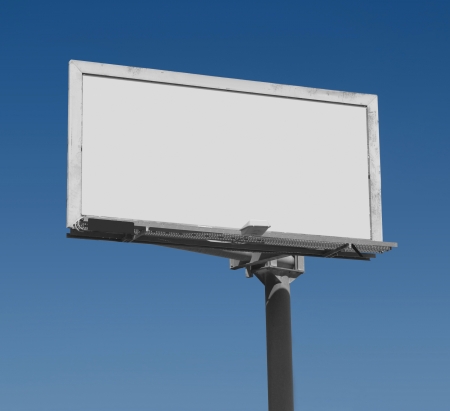 Blank freestanding billboard against a dark blue sky with clipping path for ad areaの写真素材