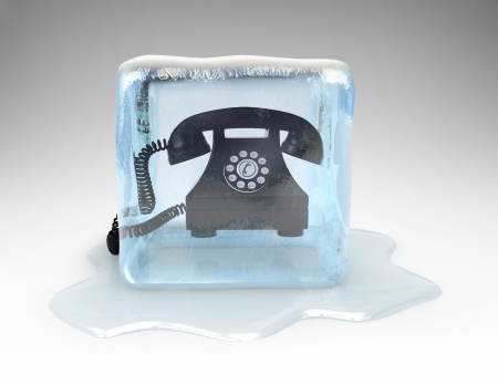 Telephone frozen in a block of iceの写真素材