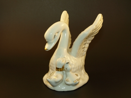 Krasnik, Poland - May 05: Small wihite swan's ceramic figurine on  black background in studio on May 05, 2008 in Krasnik, Polandのeditorial素材