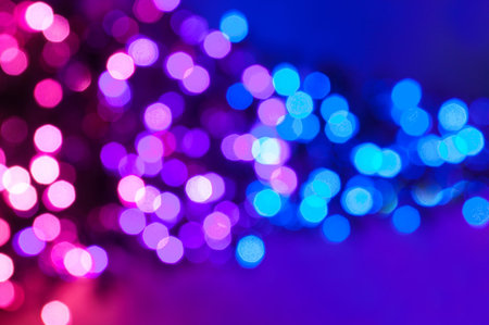Pink, purple and blue defocus lights abstract background.