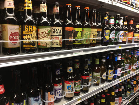 MADISON, WI/USA - November 7, 2016: A selection of microbrew beer, craft, IPA, domestic and imported beers from around the world for sale at a local grocery store in Madison, Wisconsin.のeditorial素材