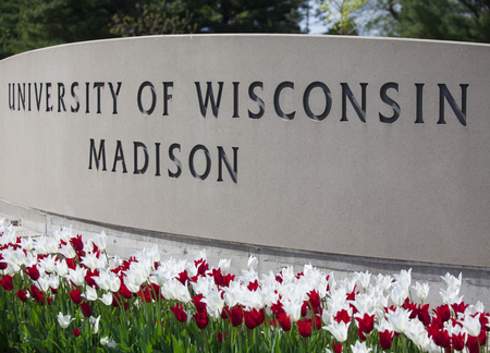 Madison, WI, USA - May 12, 2017: The University of Wisconsin crest and welcome sign is seen near the entrance to the UW Madison campus in Madison on May 8, 2015.のeditorial素材