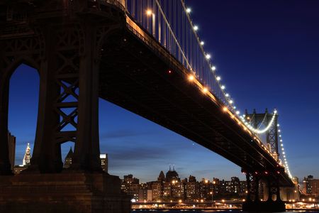 New York City Skyline and Manhattan Bridge At Nightの写真素材