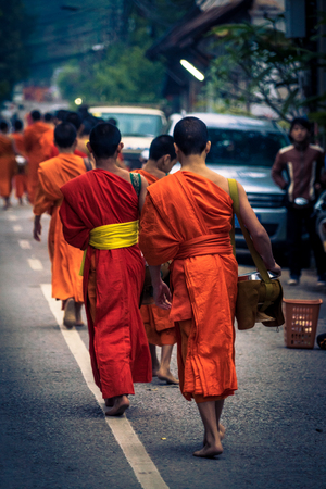 Luang Prabang. February 6, 2016. Monks collecting the morning alms in Luang Prabang. The city is a UNESCO world heritage site in Laosのeditorial素材