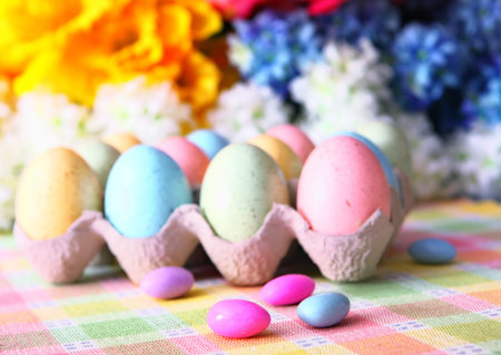 Pastel Easter Eggs And Almond Candy ~ Flowers In Background