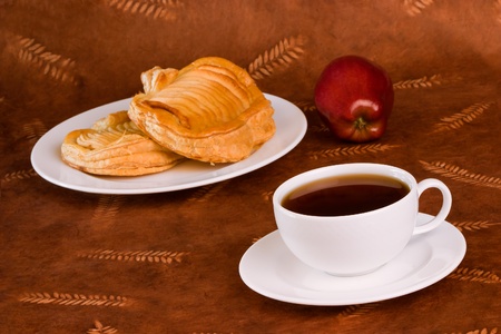 Glazed French Apple Pastry and Coffee or Tea の写真素材