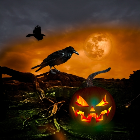 Scary Twilight Full Moon with orange sky and pumpkinの写真素材