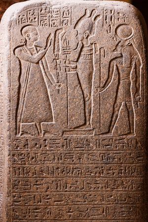 Ancient Egyptian hieroglyphs engraved in stone - Cairoの写真素材