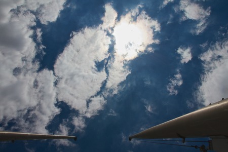 Flagpole in front of summer skyの写真素材