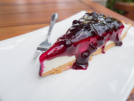 Blueberry cheesecake on a white plateの写真素材